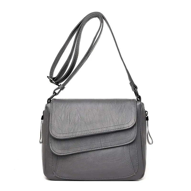 Petit sac bandoulière, design, asymétrique et matière souple ￼